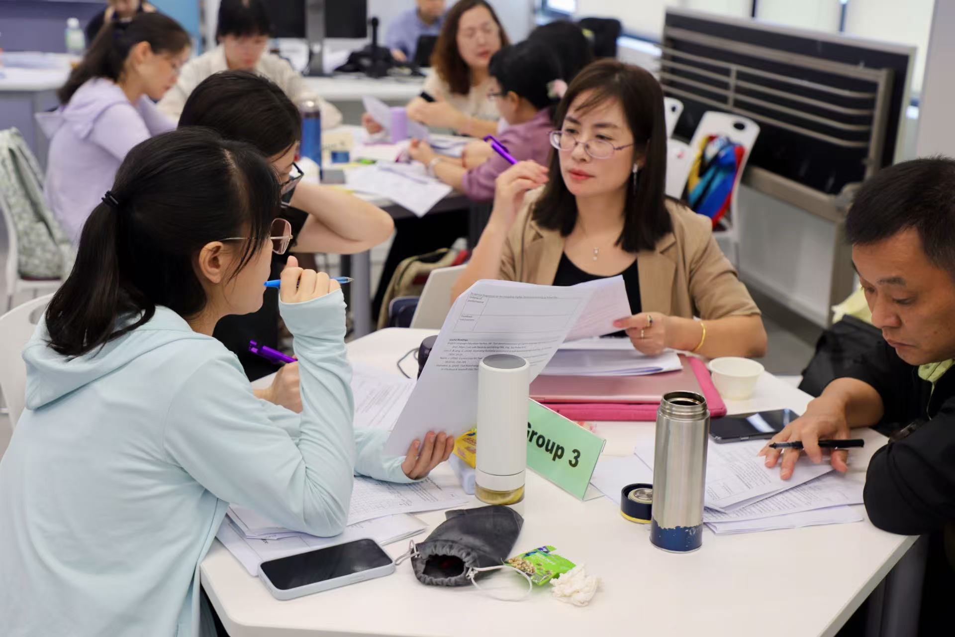 Teachers participating in a collaborative workshop activity